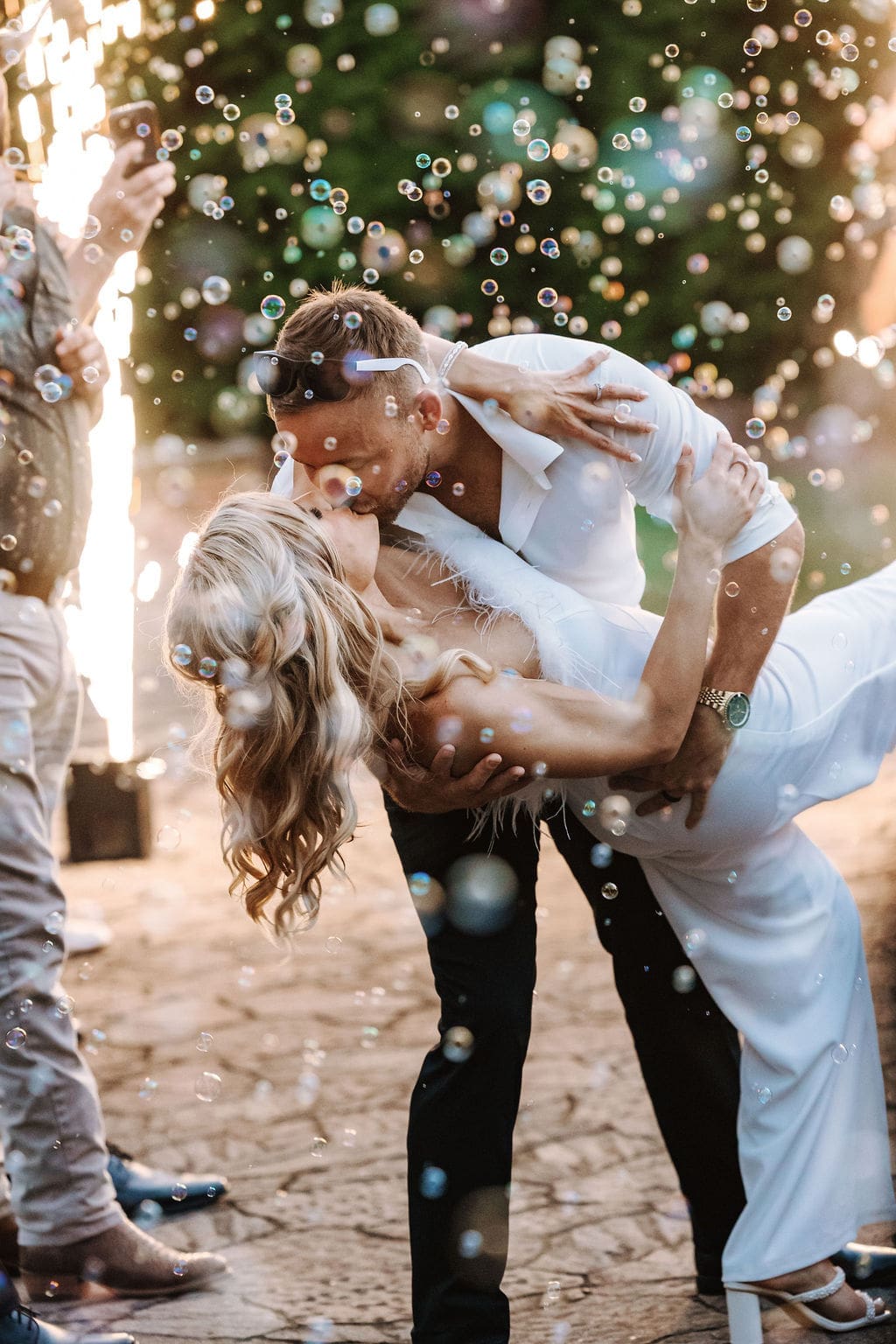 Bride and groom dip at Howe Farms in their cold spark send off.